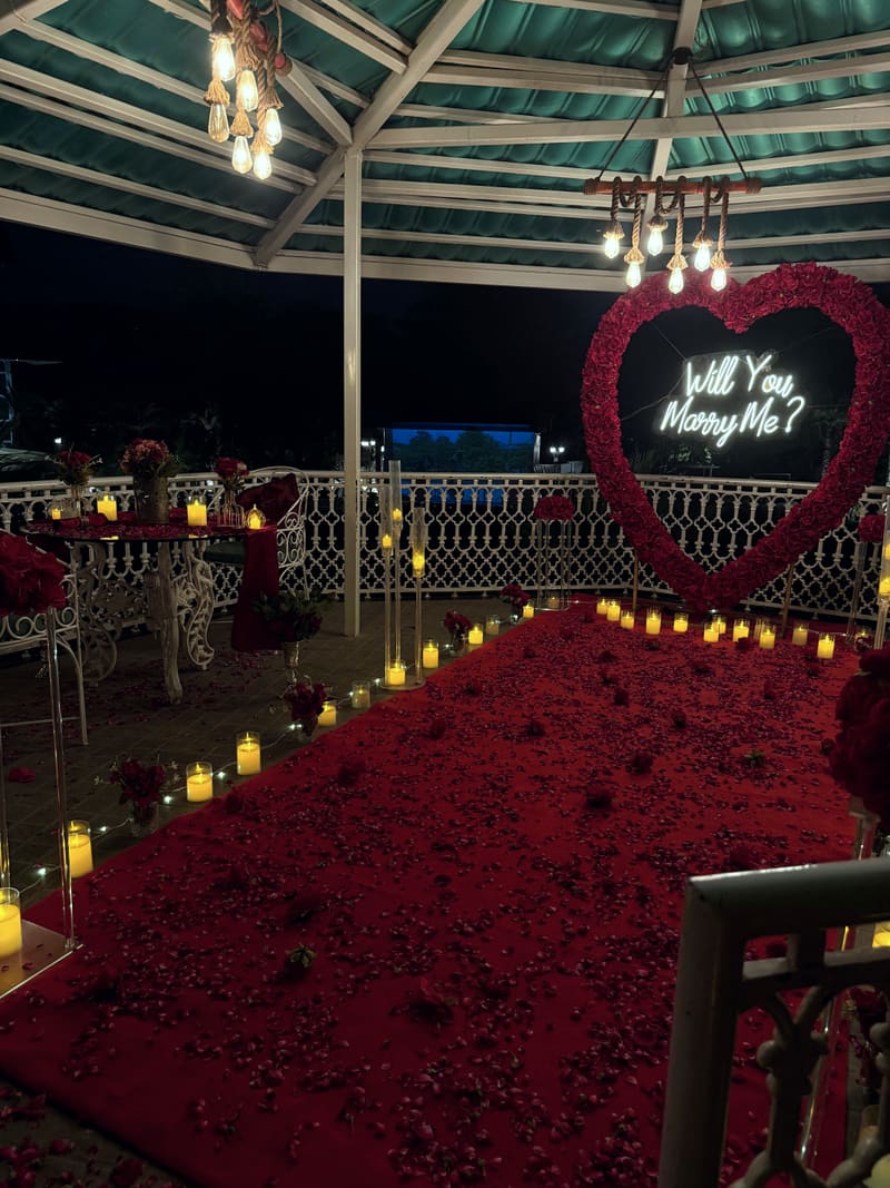 Proposal setup with candles and flowers by Cupid Vow, Chandigarh