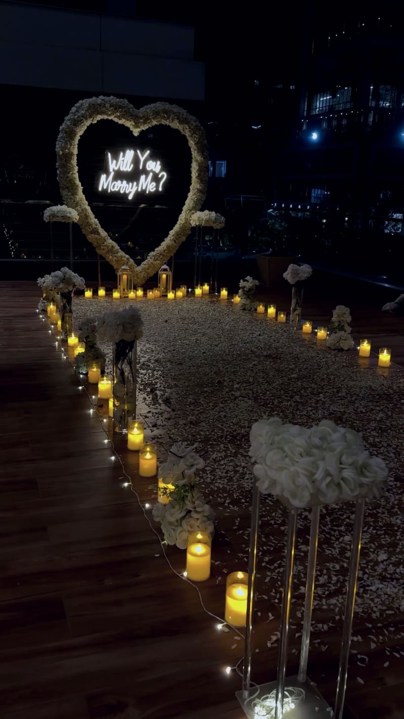 Proposal setup with candles and flowers by Cupid Vow, Chandigarh